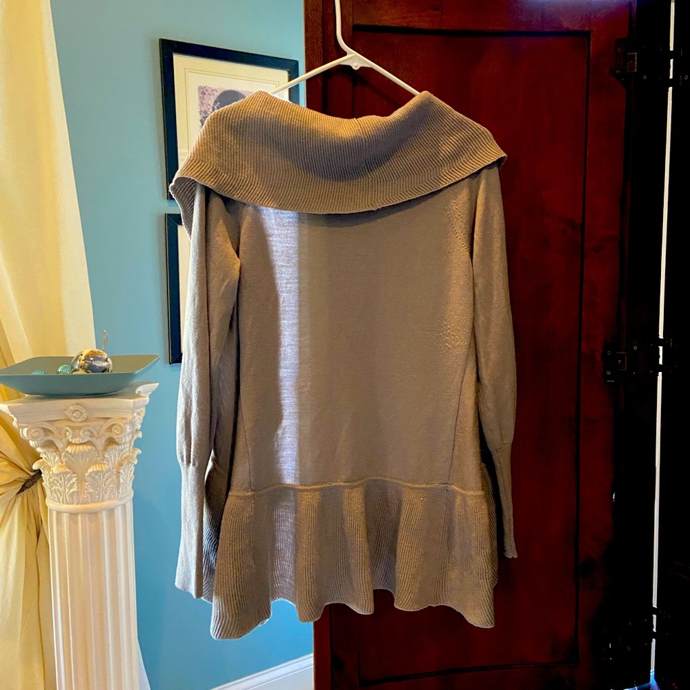 Warm stylish sweater with ruffle closure